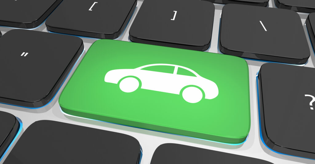 Green keyboard key with car icon symbolizing digital and omnichannel auto shopping experience for credit union members.