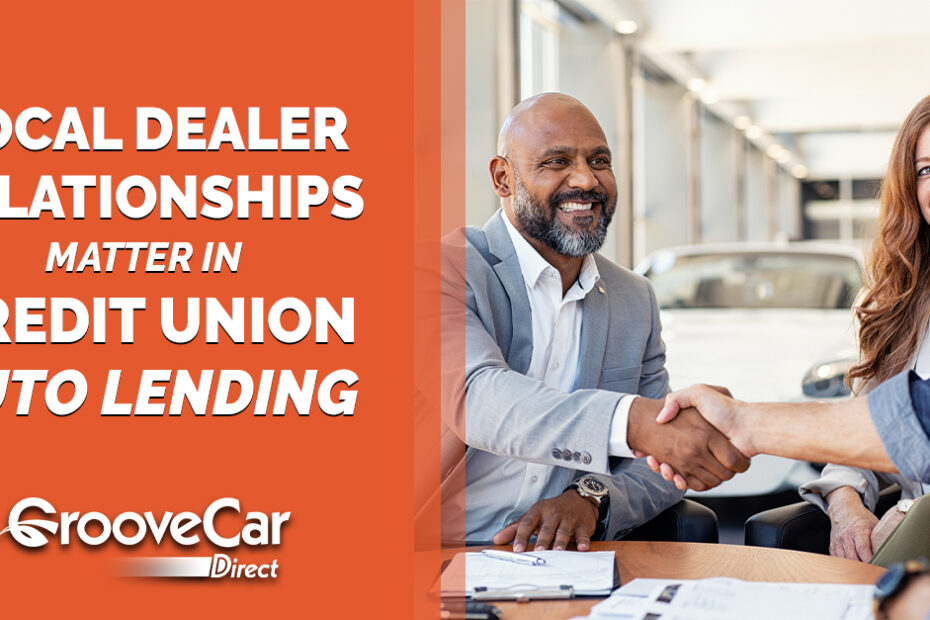 Credit union and auto dealership professionals shaking hands, representing local dealer relationships in credit union auto lending